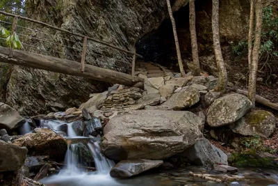 Arch Rock and footbridge over waterfall on Alum Cave Trail