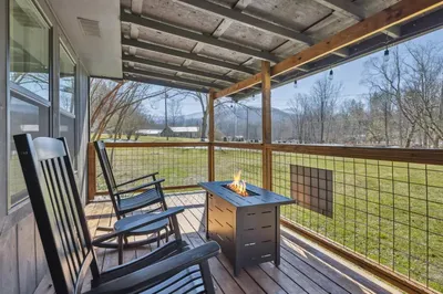 The Sherridan deck with fire pit and mountain view