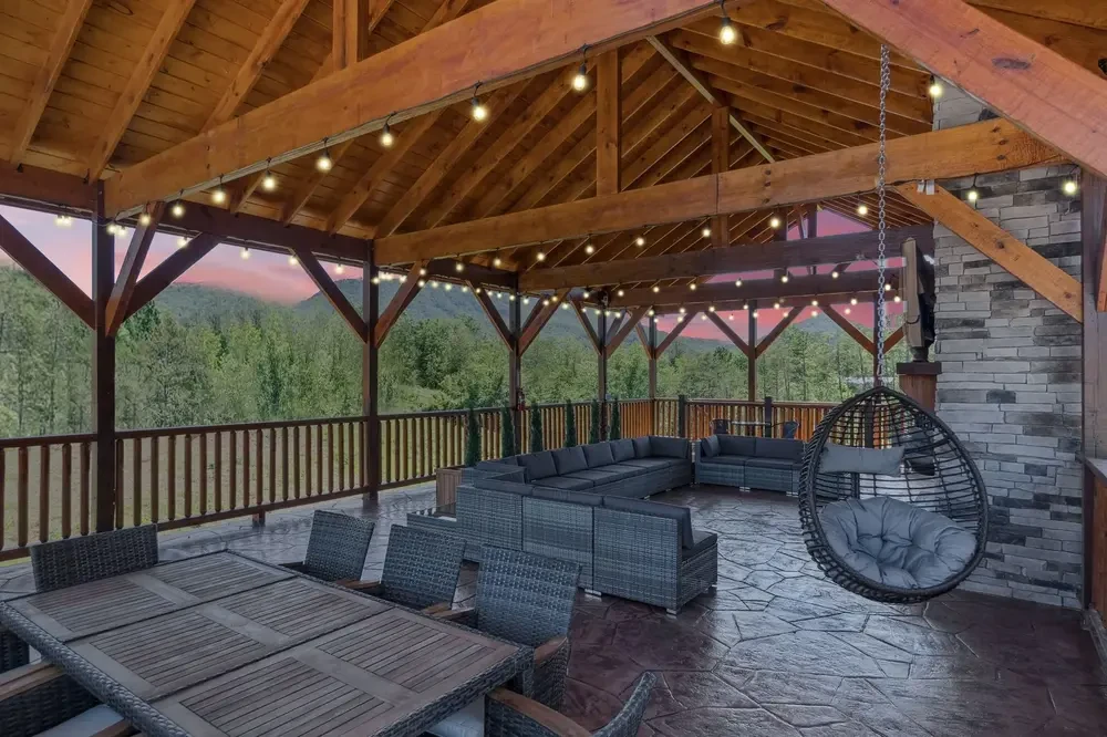 seating around the outdoor fireplace at Splash Mountain Lodge