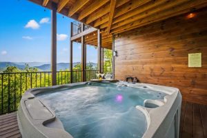 Endless Blue Sky cabin deck with hot tub and view