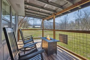 The Sherridan deck with fire pit and mountain view