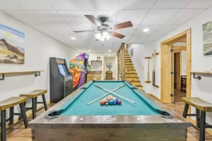 Emory House large cabin game room with pool table and arcade games